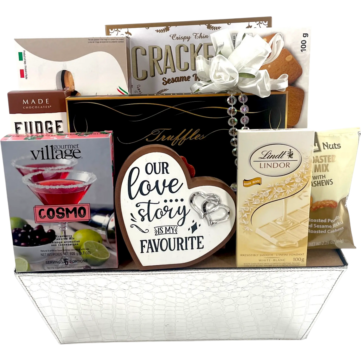 Nupcias de lujo: delicias gourmet y cesta de regalo de boda con recuerdos